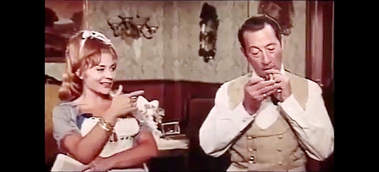 Carmen Esbri as Dominique and Miguel del Castillo as Arnold, plotting the demise of newly insured twins in The Twins from Texas (1964)