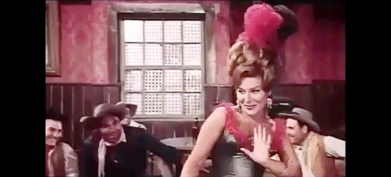 Carmen Espri as Dominique, treating the saloon crowd to a saucy song and dance in The Twins from Texas (1964)
