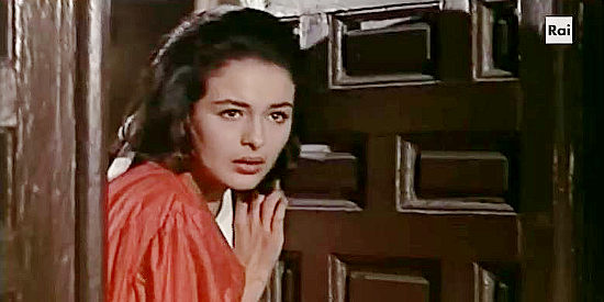 Charito del Rio as Ana Luisa Guzman, about to interrupt the intruders in her home in The Implacable Three (1963)