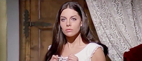 Charo Lopez as Jessica, as a frequent but unwelcome visitor barges into her bedroom in Dead Men Ride (1971)