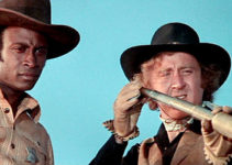 Cleavon Little as Bart and Gene Wilder as Jim (aka Waco Kid) watch Taggert's men advance in Blazing Saddles (1974)