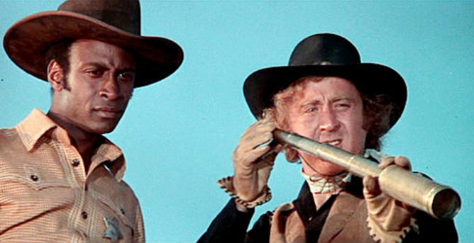 Cleavon Little as Bart and Gene Wilder as Jim (aka Waco Kid) watch Taggert's men advance in Blazing Saddles (1974)