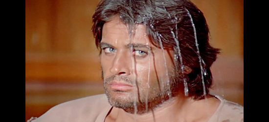 Cuneyt Arkin as Keskin, after a barroom bully has shot a full beer mug off his head in The Little Cowboy (1973)