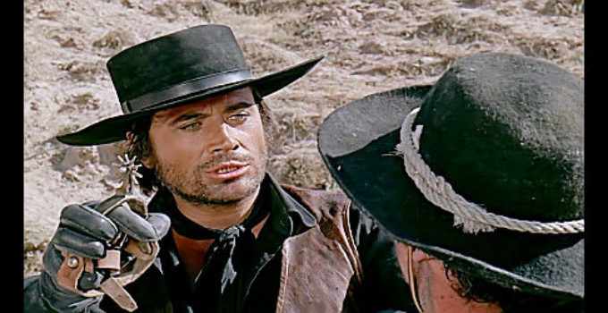 Cuneyt Arkin as Keskin, using a spur to get the information he wants in The Little Cowboy (1973)