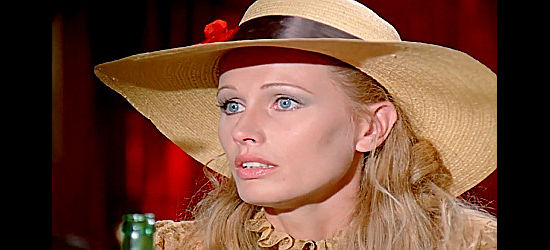 Ida Galli (Evelyn Stewart) as the kid's mother, trying to urge Keskin to help her son in The Little Cowboy (1973)