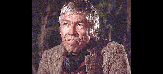 James Coburn as Luke Matthews, the man betting big money on winning the horse race in Bite the Bullet (1975)