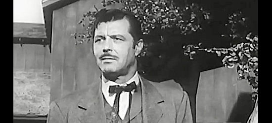 James Craig as Bick Justin, the man with the town of Canogee under his thumb in The Persuader (1957)