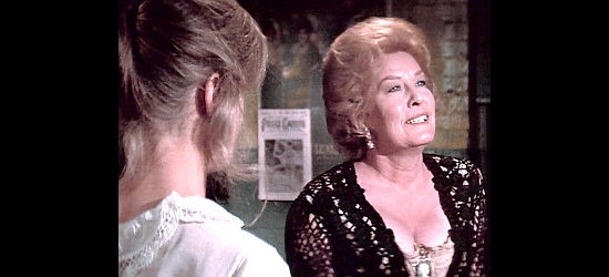 Jean Willes as Rosie, the madam who follows the race with her whores and her booze in Bite the Bullet (1975)