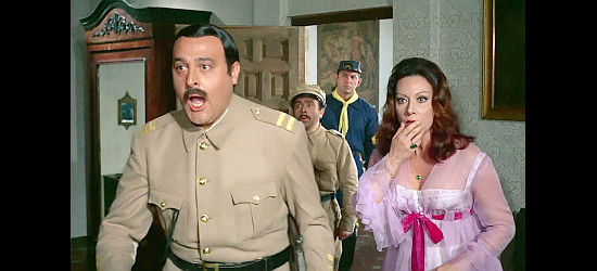 Jesus Puente as Capt. Hernandez and Lina Rosales as Consuela react to a surprise in her room in Fistful of Knuckles (1965)
