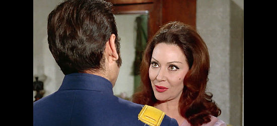 Lina Rosales as Consuela, Capt. Hernandez's unfaithful wife, meeting her love in Fistful of Knuckles (1965)