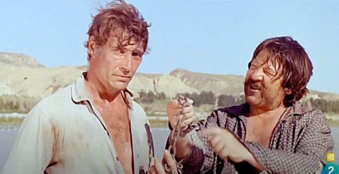 Luis Davila as Ray and Fernando Sancho as Carrancho deciding which path to take in Man From Canyon City (1965)