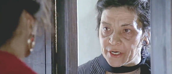 Marcella Valeri as Dorotea, Carmen's landlady, growing tired of her antics in Man, Pride and Vengeance (1967)