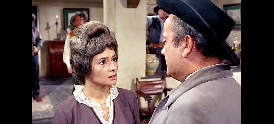 Maria Badmajew as Mrs. Brenton, wondering if there isn't a more peaceful option in Fistful of Knuckles (1965)
