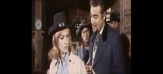 Maria Pia Conte as Mariam Grady winds up in the arms of the wrong man, Mayor Aldo Rudell (Alberto Farnese) in Five Dollars for Ringo (1966)