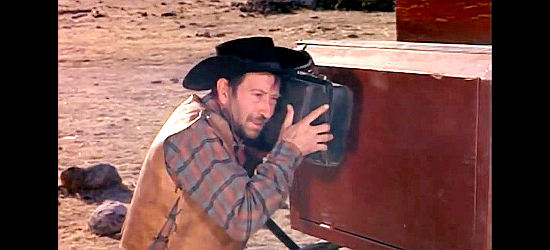 Miguel Del Castillo as Pablo, preparing to place explosives on a stagecoach in Heroes of the West (1964)