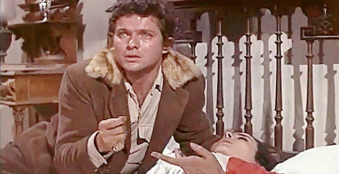 Geoffrey Horne as Don Cesar Guzman, with a piece of evidence found clutched in the hand of his dead wife in The Implacable Three (1963)