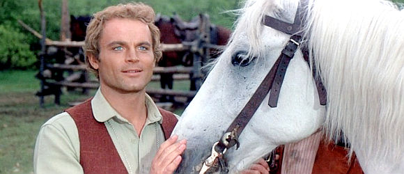 Terence Hill as Sir Thomas Moore with the white stallion he receives as a gift in Man of the East (1972)