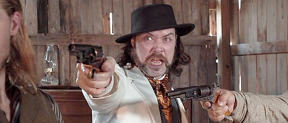 Andy Arrasmith as Tully Ford, ready for a showdown even with a gun pointed his way in Honor Among Thieves (2021)
