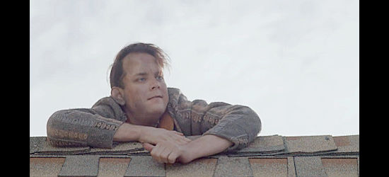 Austin Buchanan as Marcus, climbing onto the church roof in She Was the Deputy's Wife (2021)