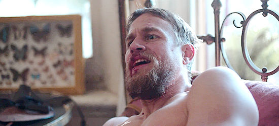 Charlie Hunnam as Sgt. O'Neil, caught in a compromising position by Ned and Harry Powers in True History of the Kelly Gang (2019)