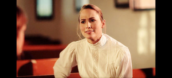 Danielle Demski as Clara Roberts, the pastor's wife who takes Mattie under her wings in Renegade (2011)