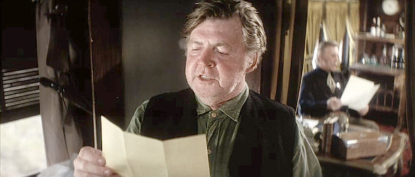 Dick O'Neil as Wiley, the publicity manager who documents Nightingale's exploits in Posse (1975)