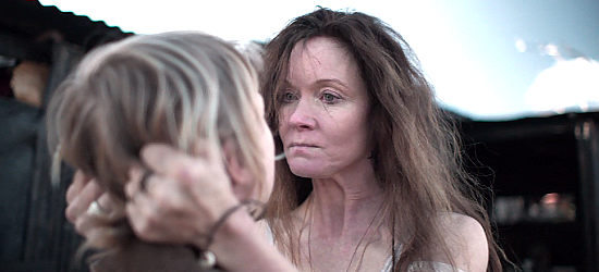 Essie Davis as Ellen Kelly, teaching young Ned a lesson in the harsh realities of life in True History of the Kelly Gang (2019)