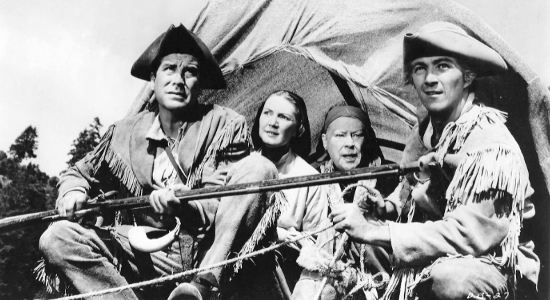 Faron Young as Faron Calloway and friends on a wagon bound for Boonesboro in Daniel Boone Tral Blazer (1956)