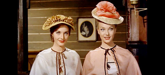 Leonora Ruffo as Sara Perkins and Helen Chanel as sister Alice welcome their 'hired guns' to town in A Dollar of Fear (1960)
