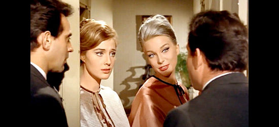 Leonora Ruffo as Sara and Helen Chanel as Alice discuss sleeping arrangements with Mike and Alamo in A Dollar of Fear (1960)