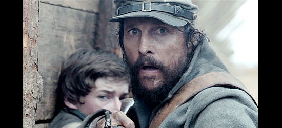 Matthew McConaughey reacts after shooting down a Union soldier while Daniel (Jacob Lofland) looks on in Free State of Jones (2016)