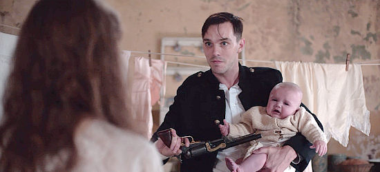Nicholas Hoult as Constable Kirkpatrick, threatening Mary's baby to get information about Ned in True History of the Kelly Gang (2019)