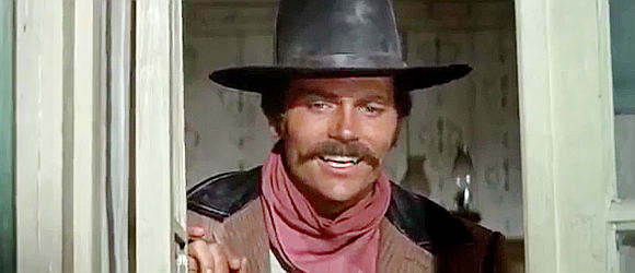 Patrick Wayne as James McCandles, admiring the party on the streets of Escondero in Big Jake (1971)
