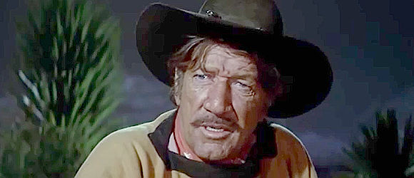 Richard Boone as John Fain, lying down the rules for the exchange of ransom for kidnapped boy in Big Jake (1971)