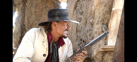 Thomas Crnkovich as Lucas Mullins, in a shack where the loot ain't and pinned down by Indians in Meaner Than Hell (2009)