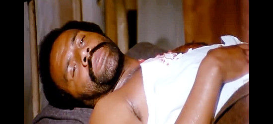 Fred Williamson as Joshua, recovering after being wounded in Joshua (1976)