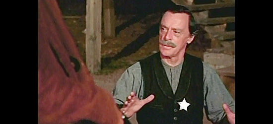 Harry Townes as Sheriff Carter, trying to reason with the Banner gang in Santee (1973)