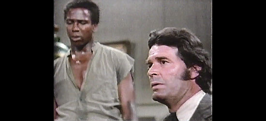 James Garner as Quincy Drew prepares to sell Jason (Louis Gossett Jr.) yet again in Skin Game (1971)