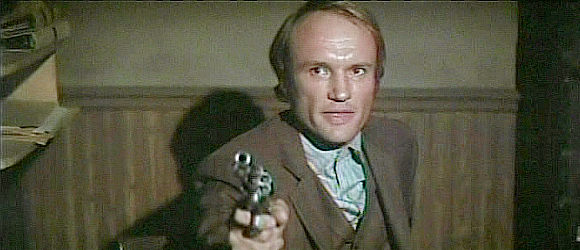 James Olson as banker Joe Billings, trying to protect his customer's deposits in Wild Rovers (1971)