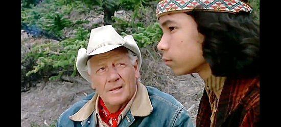 Joel McCrea as Dan, sharing some of his wisdom with Indian yough Nika (Nika Mina) in Mustang Country (1976)