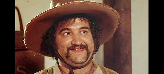 John Belushi as Deputy Hector, amused by Henry Moon's plight in Goin' South (1978)