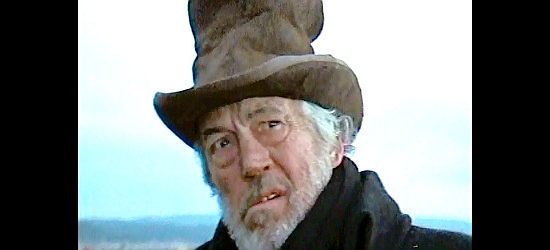 John Huston as Capt. Henry, the expedition leader haunted by thoughts of Bass in Man in the Wilderness (1971)