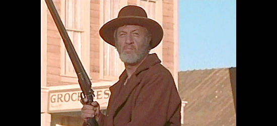 John Larch as Banner, leader of a gang of outlaws in Santee (1973)