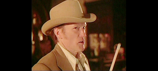 Luke Askew as Ruby Muldoon, doubting Texas Curly's story of a gold strike in Wanda Nevada (1979)