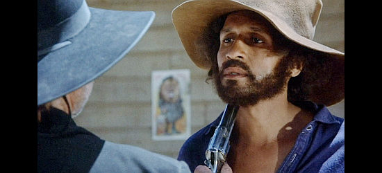 Max Julien as Bushrod, under a lawman's gun in Thomasine and Bushrod (1974)