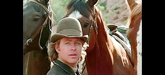 Michael Burns as Jody Deaks, holding getaway horses for a dad he just met in Santee (1973)