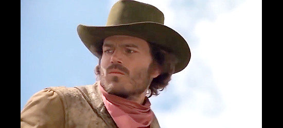 Patrick Wayne as T.J., one of the cowboys after a wild mustange in Mustang Country (1976)
