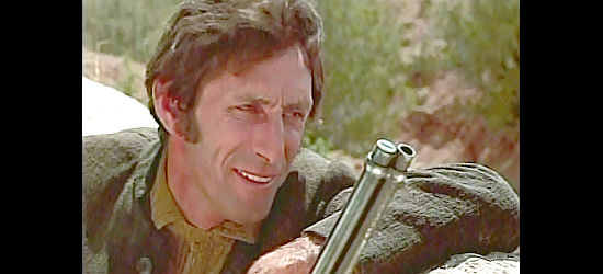 Robet Donner as J.C., a member of the Deaks gang watching for a bounty hunter in Santee (1973)