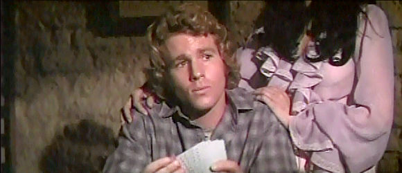 Ryan O'Neal as Frank Post, in a game of poker that's about to turn violent in Wild Rovers (1971)