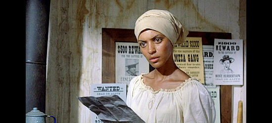 Vonetta McGee as Thomasine, finding the wanted poster for Bushrod in Thomasine and Bushrod (1974)